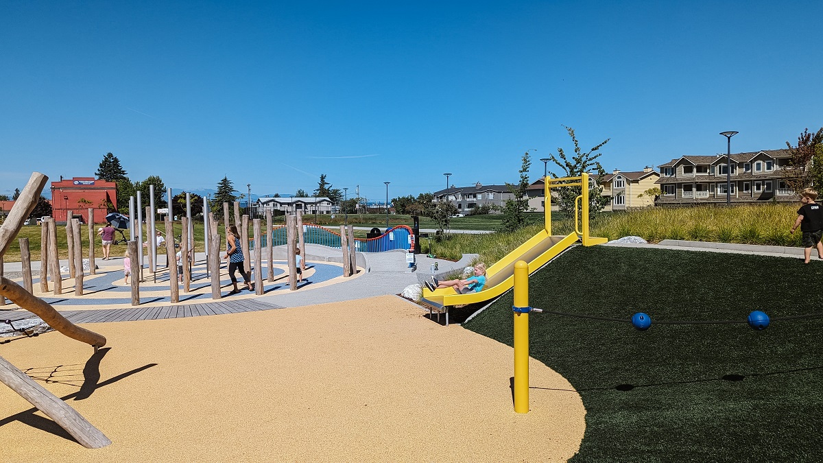 Kids play on the new Mika’s Playground at Edmonds Civic Center Playfield