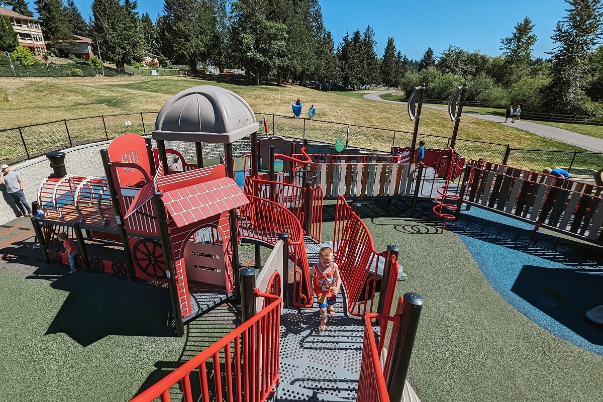 View of the new playground at Ballinger Park in Mountlake Terrace near Seattle which features poured rubber surfacing and other inclusive play elements