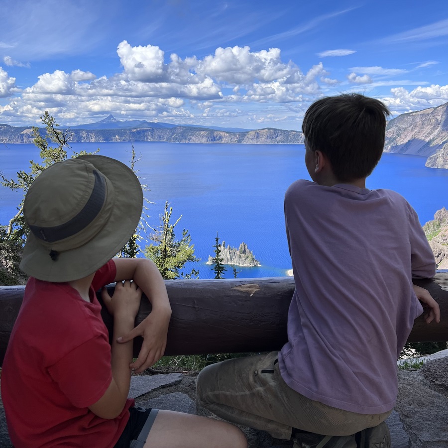 Two young boys take in the view of the Phantom Ship in Crater Lake