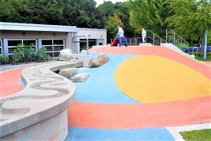 Kids playing at inclusive, accessible Seattle Children’s Playgarden