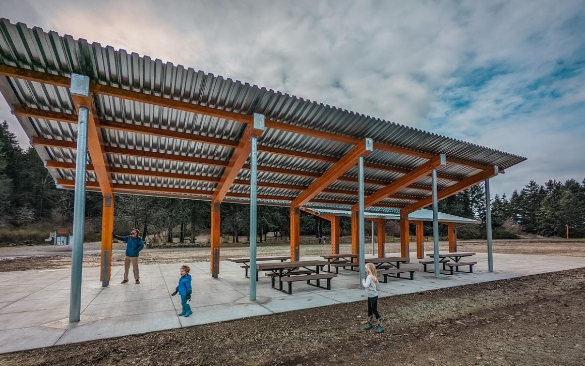 View of large new covered picnic shelter at Tacoma's updated Swan Creek Park Lister Uplands area