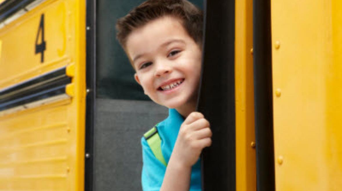 Boy smiling on school bus