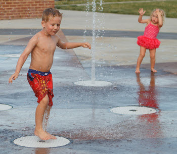 Kids playing in a fountain