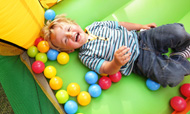 Happy child in balls