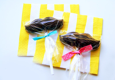 Birthday chocolate mustache lollipops by Amy is the Party