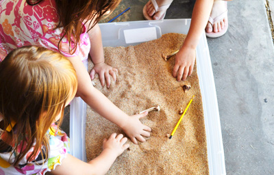Dinosaur sensory tub for kids by Motherhood on a Dime