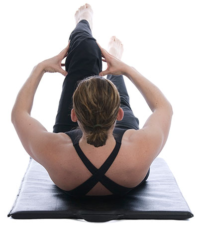 woman doing yoga indoor workouts winter