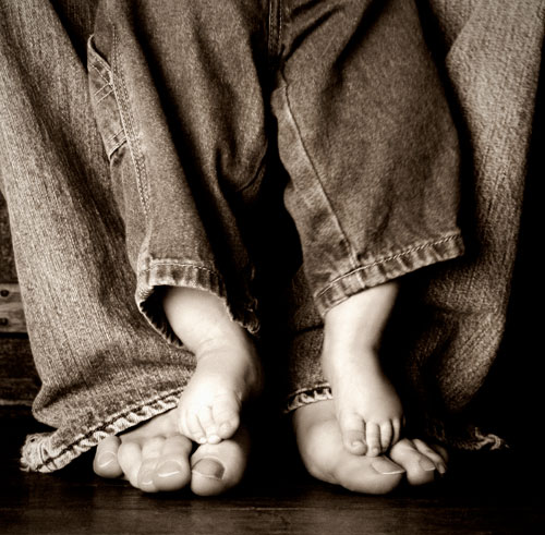 Dad's and kid's feet
