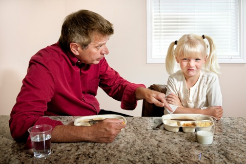 dad with daughter at mealtime