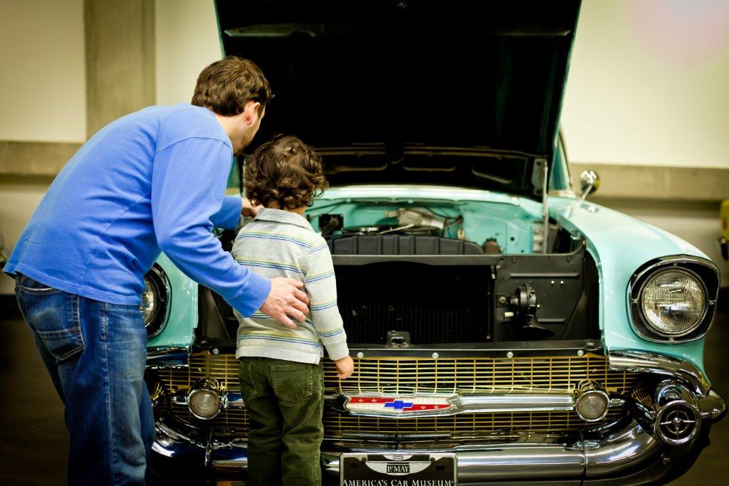 father boy old car museum