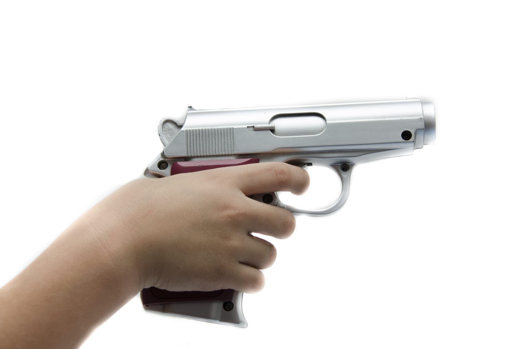 child's hand holding a gun
