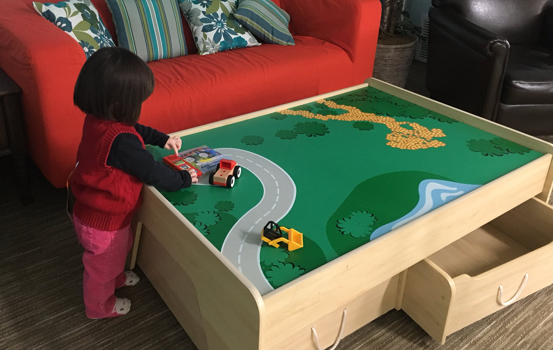Couches and train table, JuzPlay. Photo credit: April Chan