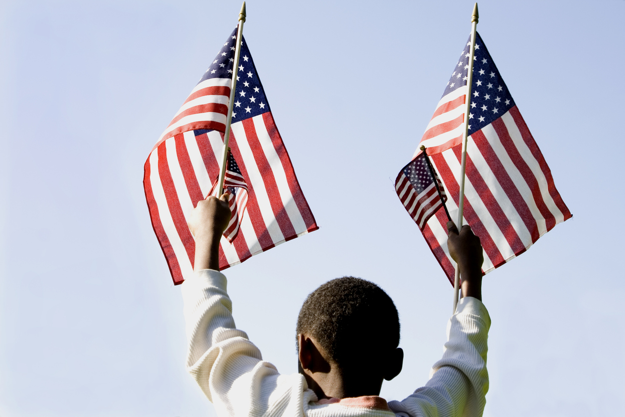 black boy holding american flag
