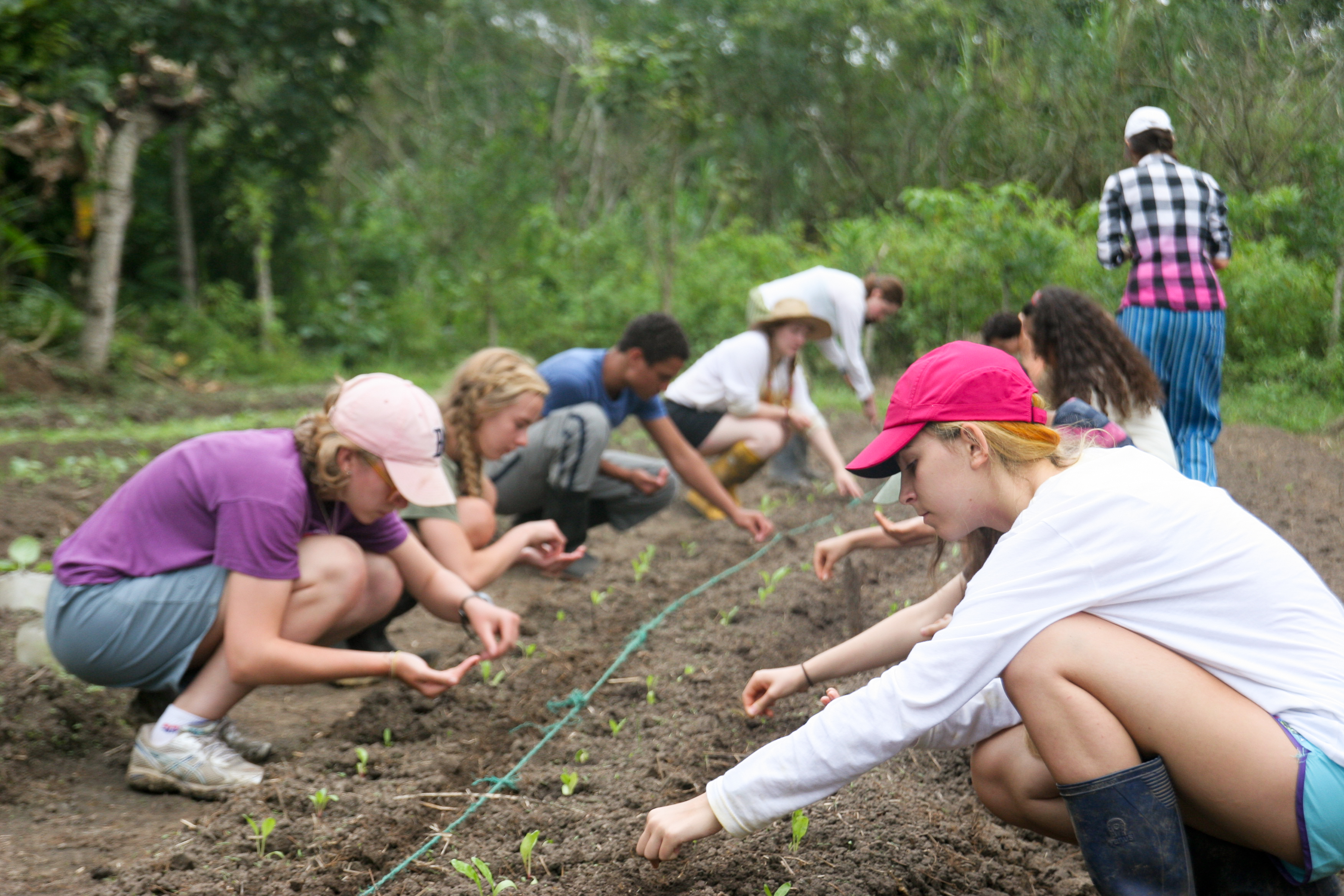 Sustainable Summer Photo of Teens learning organic gardening principles international travel study abroad