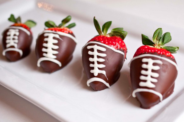 Super Bowl Snack: chocolate-covered football strawberries by Domestic Fits