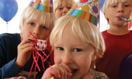 Crowd of boys in party hats