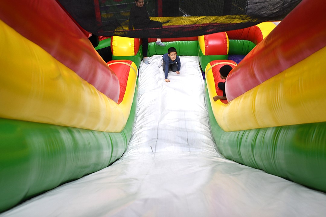 At indoor playgrounds, Seattle families play on rainy days, including at Arena Sports’ Family Entertainment Center in Issaquah, with inflatables and more