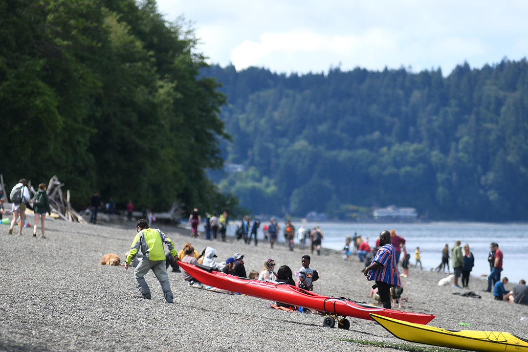 Kayakers haul out their boats at newly reopened and improved Owen Beach in Tacoma's Point Defiance Park