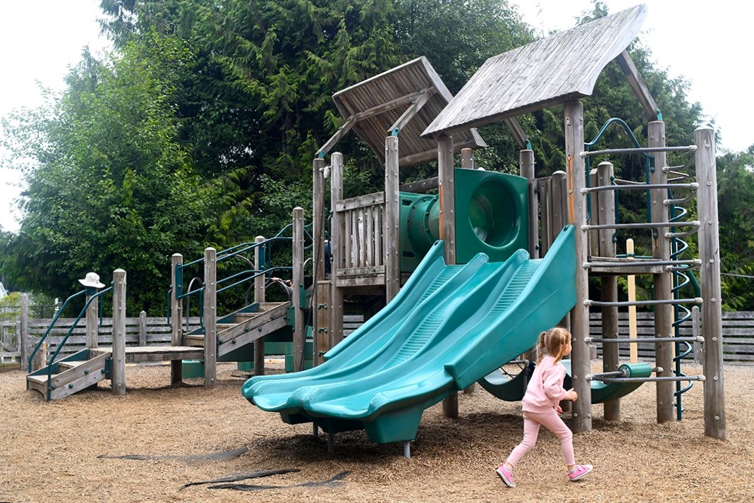 A girl plays on the playground at Seabrook, a popular beach town for Seattle families to visit
