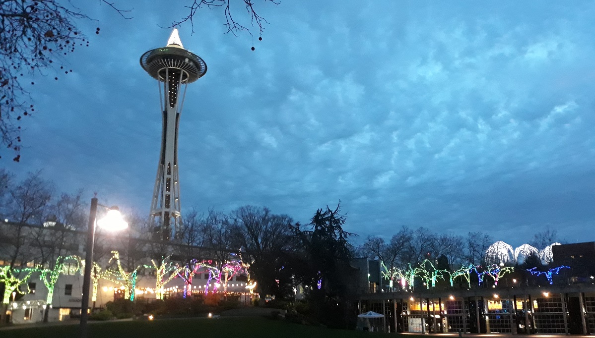 View of the Space Needle at Seattle Center at holiday time and Seattle Center campus dressed up in lights