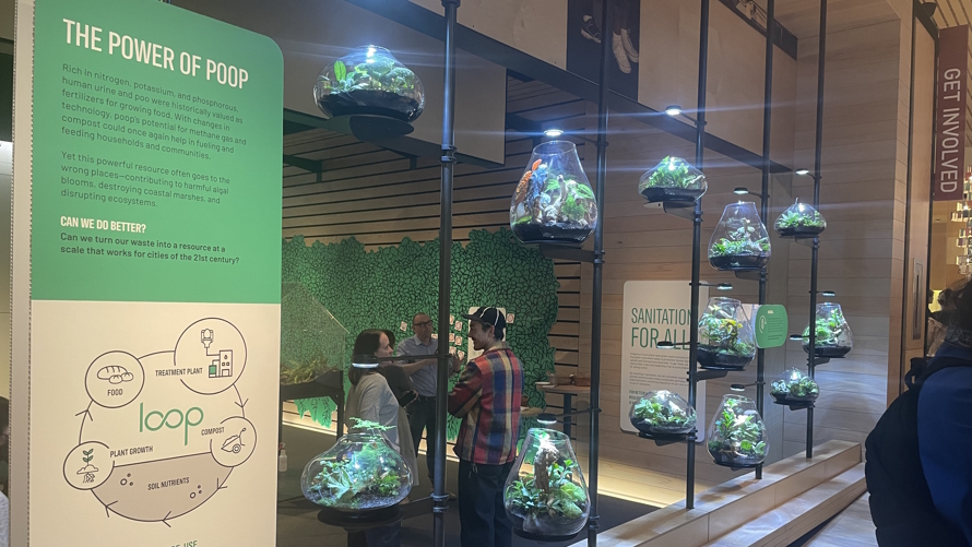 "Biosolids and terrariums display Gates Foundation Discovery Center sanitation exhibit"