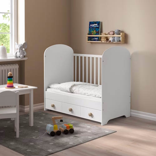 "Crib that converts to a toddler bed with storage from Ikea for a kids bedroom"