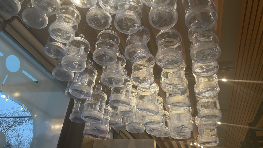 "water jugs hanging from the ceiling. Gates Foundation Discovery Center sanitation exhibit"