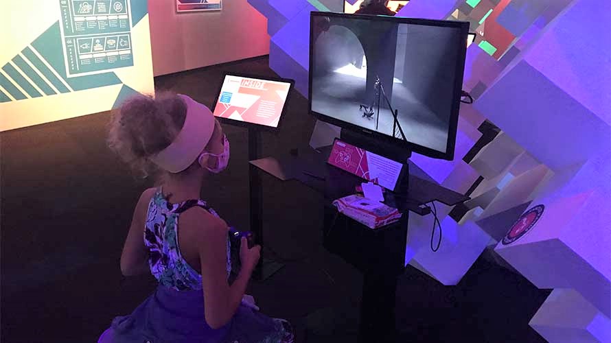 Girl playing at MoPop Indie Game Revolution reopened museum Seattle