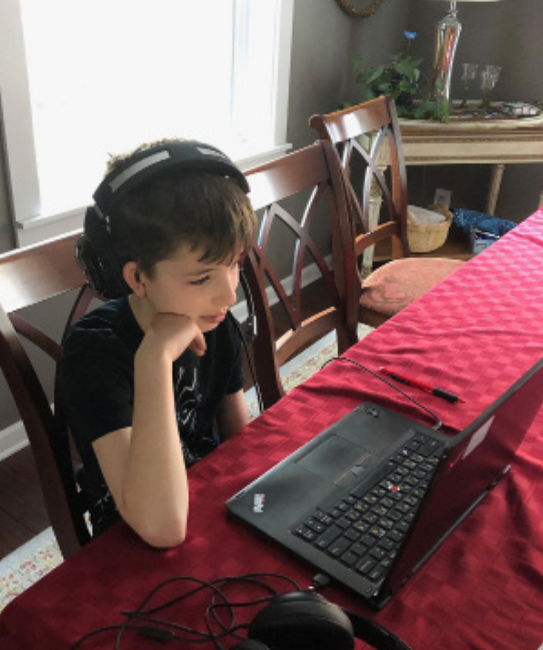 Young student practicing distance learning from home