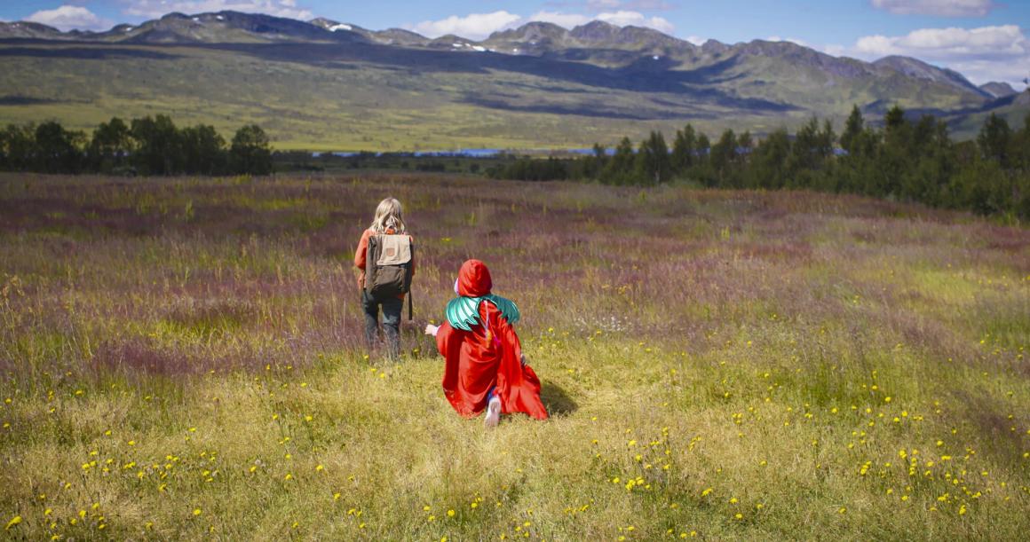Video still of two girls walking in a meadow from the film Sisters: The Summer We Found Our Superpowers Children's Film Festival Seattle 2021