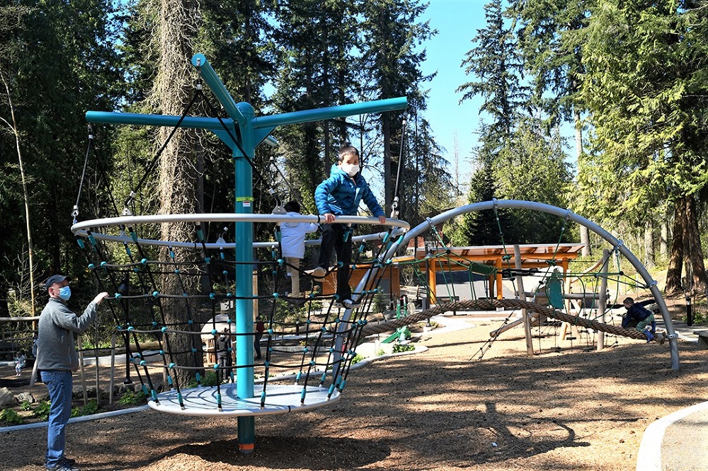Spinning rope climber bucket feature at new Suquamish Shores Natural Play Area 