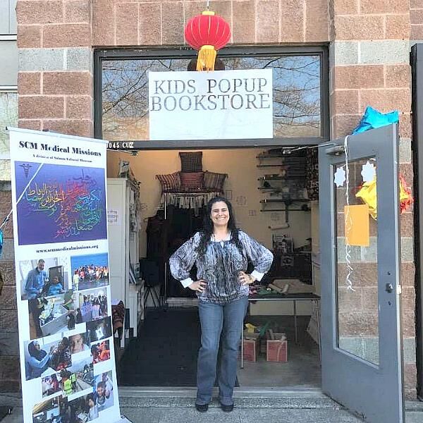 Koloud "Kay" Tarapolsi pictured in front of her pop-up bookstore, Our Little Voices