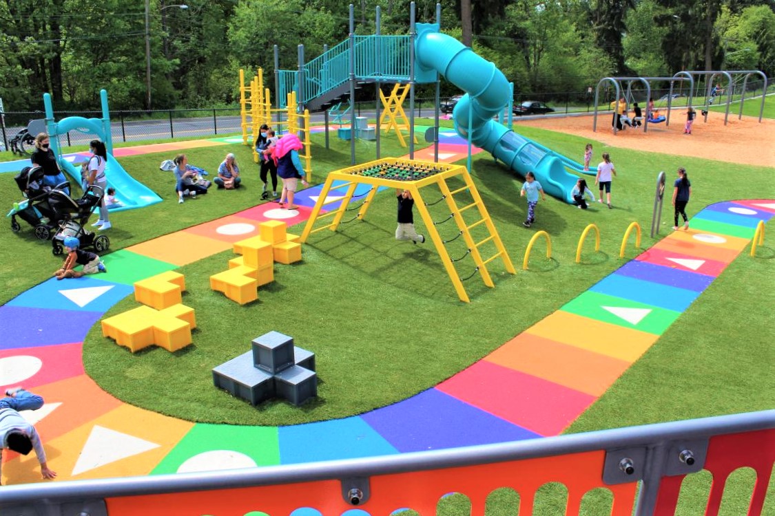 Overview fo colorful Slides and Climbers style life size board game at West Fenwick Park in Kent, Washington, near Seattle best new parks kids families