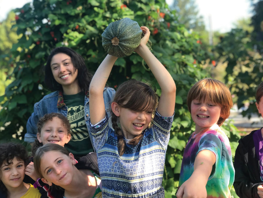 seattle cucina kids outside with squash