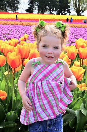 girl in front of tulip field