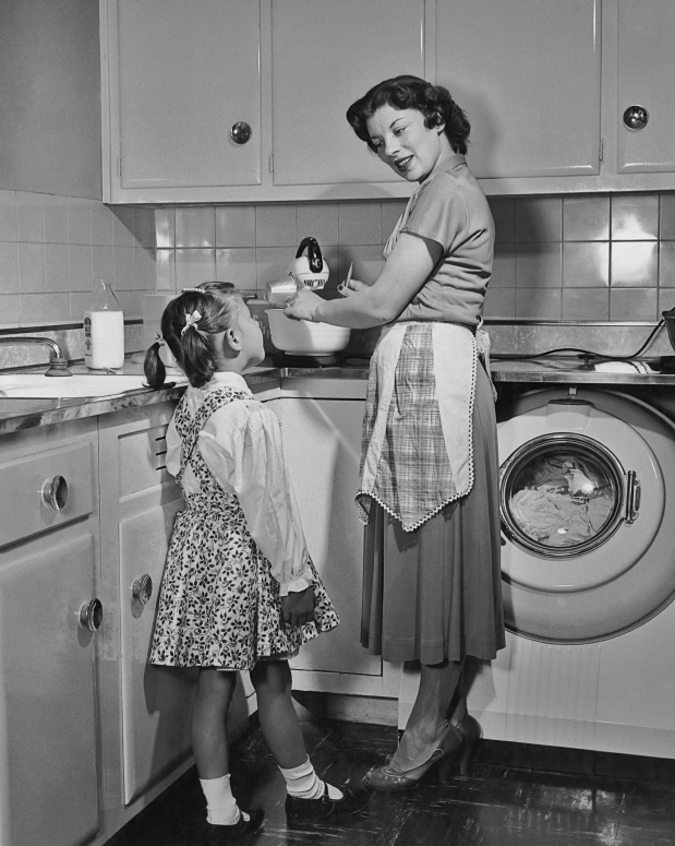 Vintage photo of a mother and child in a kitchen
