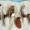 Frozen bananas covered in chocolate and sprinkles is a simple birthday party snack to make