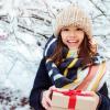 girl with present and snowy background
