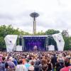 Bumbershoot stage with crowd and Space Needle in the background at Seattle Center