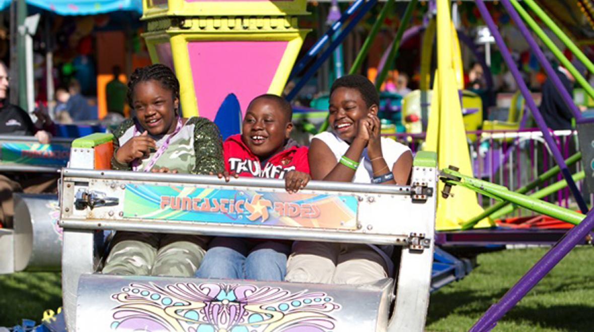 kids on a ride at the fair