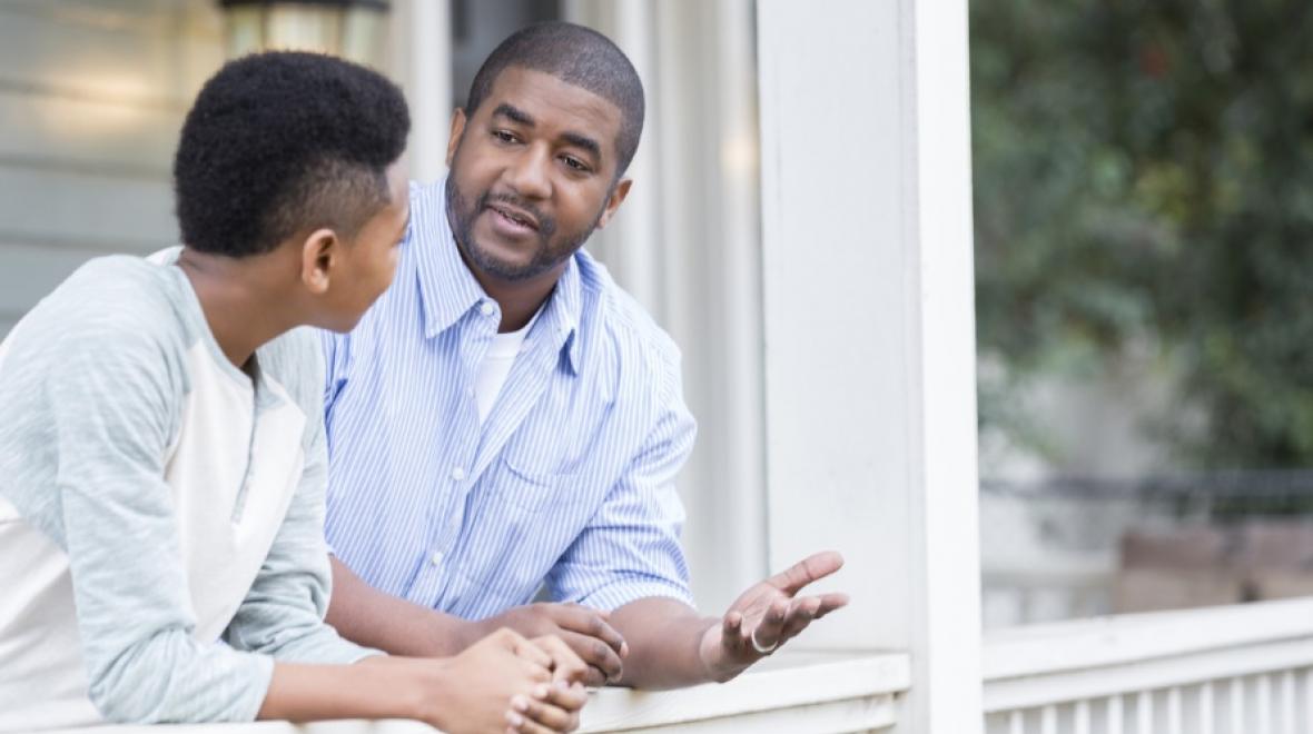 Father having serious talk with teenage son