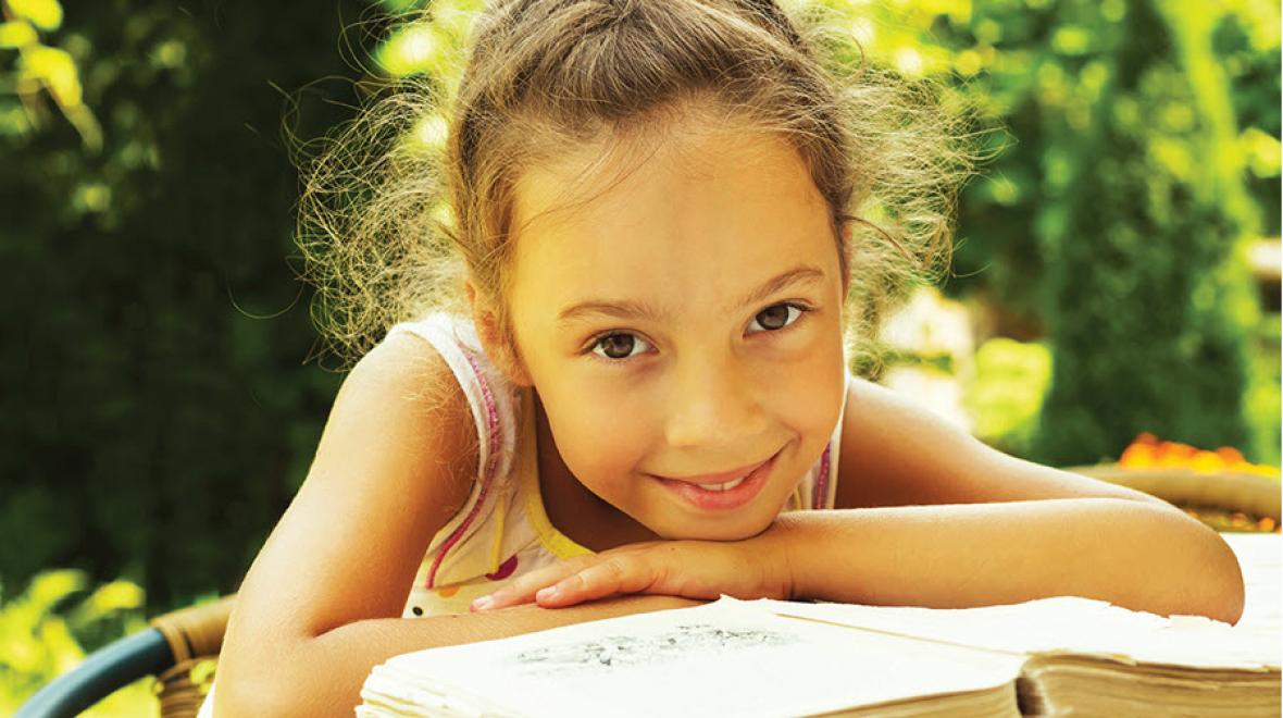 Young girl reading a book