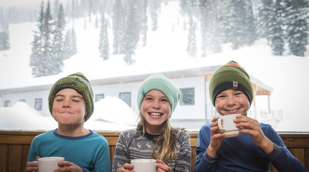 kids sipping hot chocolate at whitewater resort