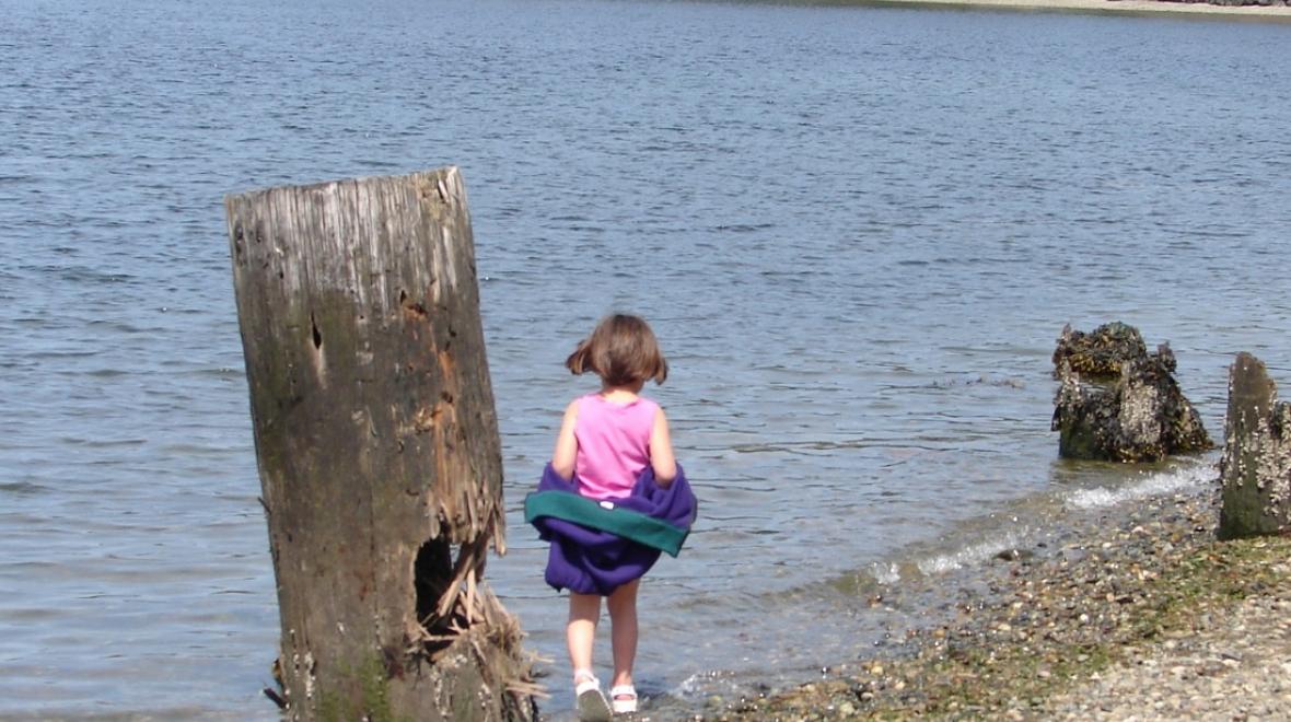 Titlow beach park Tacoma girl wading after enjoying lunch at a picnic spot in Seattle