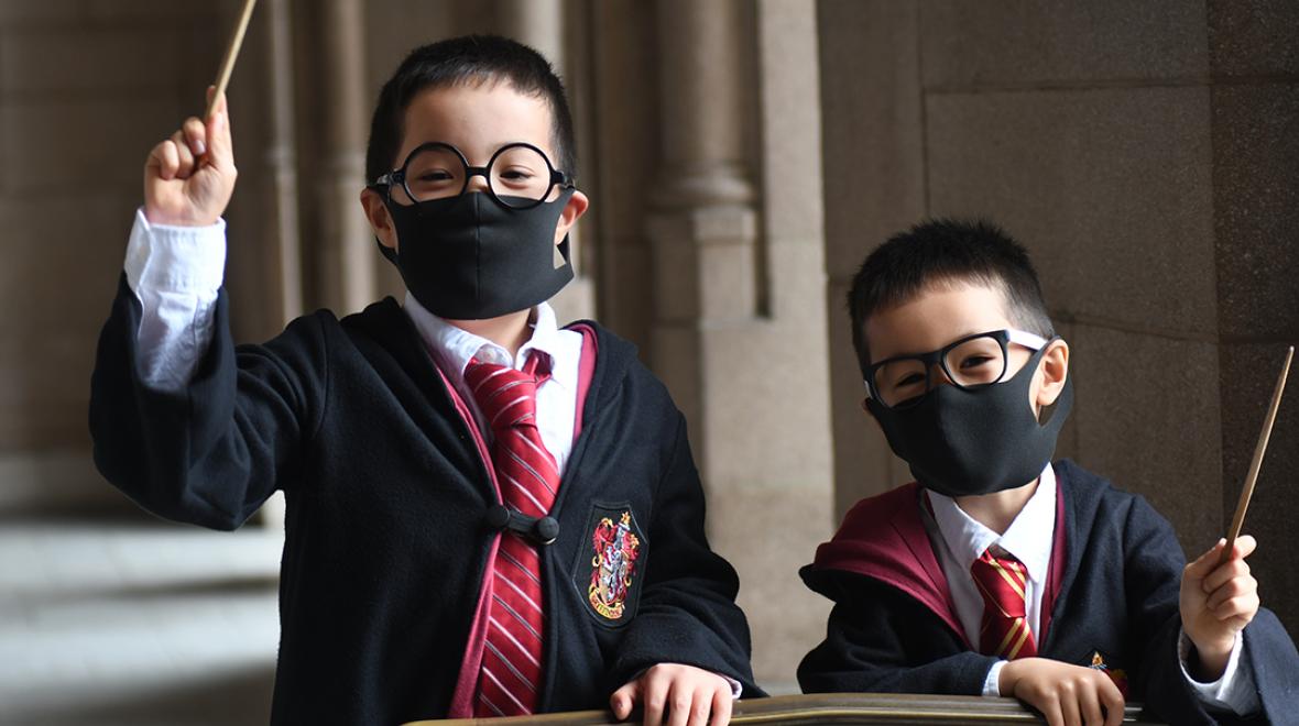 brothers dressed up in harry potter costumes and face masks for Halloween 2020