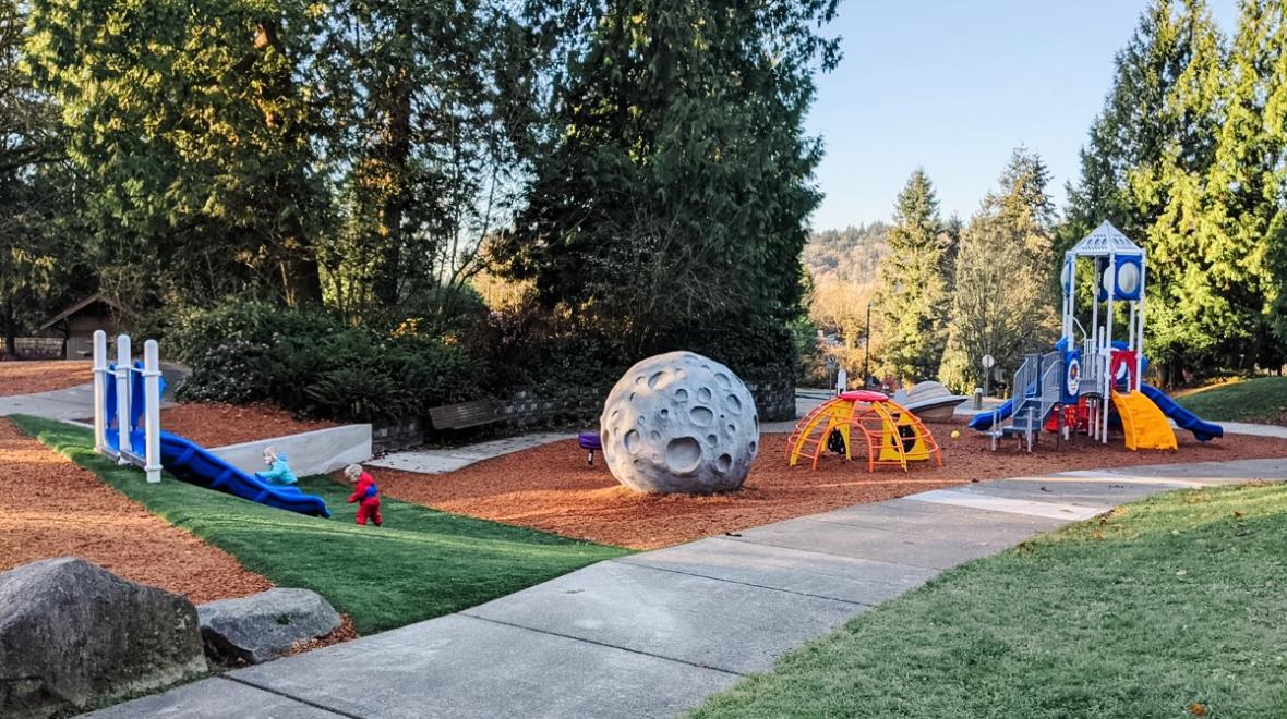 Wide view of new space-themed playground now open at North Kirkland Community Center