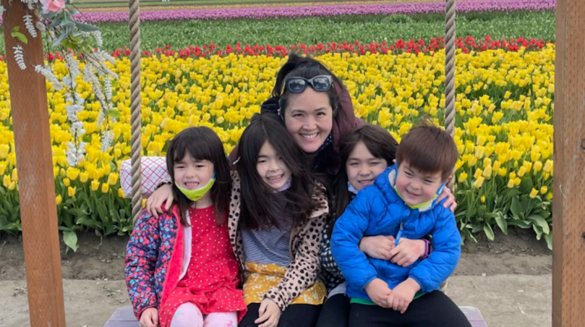 Vivian Song Maritz and her kids with tulip fields in the background