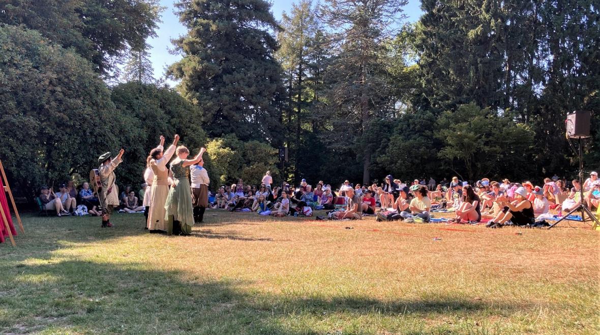 Actors perform a Shakespeare play in Seattle's Volunteer Park with the free Backyard Bard program as audience members look on