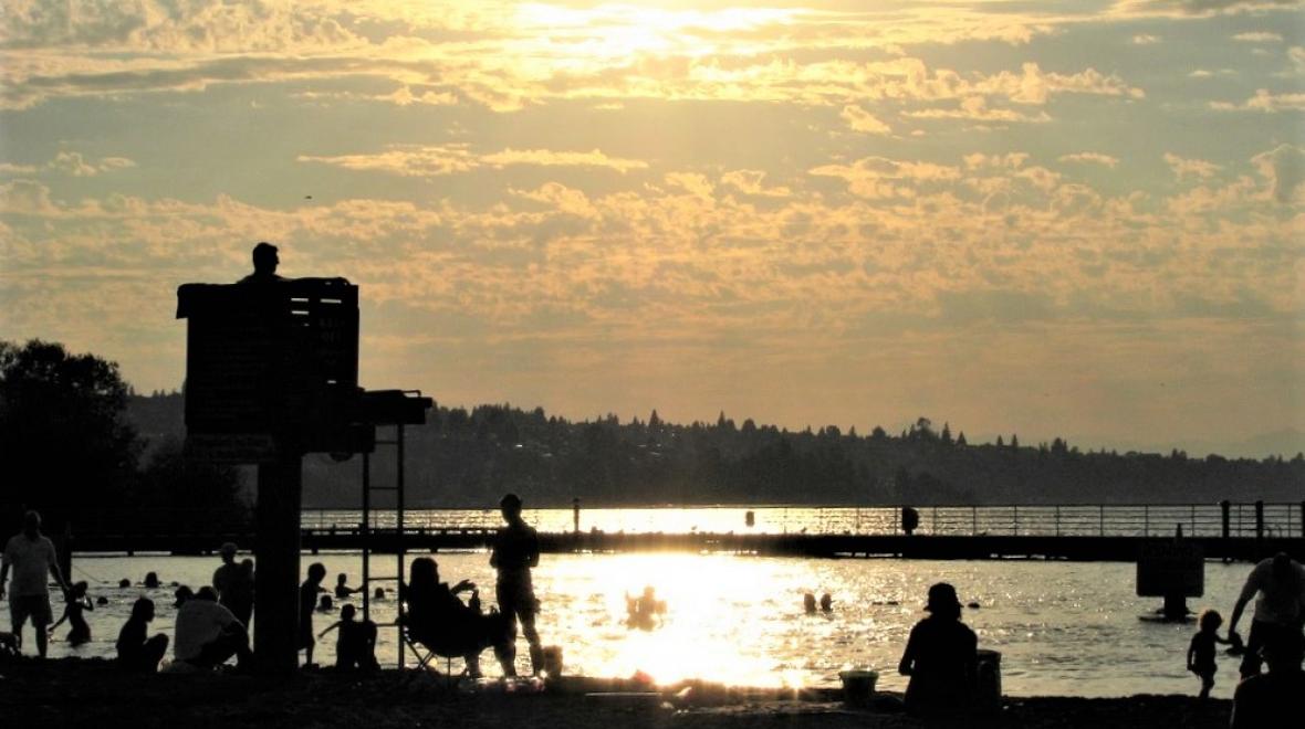 Sunset view of swimming beach at Gene Coulon Memorial Beach Park in Renton near Seattle Puget Sound best swimming lakes