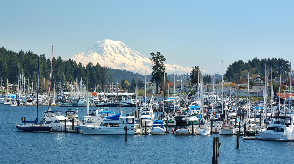 View of Gig Harbor waterfront marina with Mount Rainier in the background